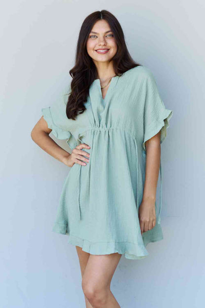 Stepping Out Ruffle Hem Dress with Drawstring Waistband in Light Sage